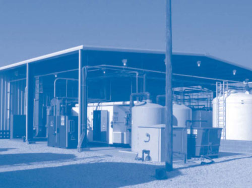 Figure 3. Cryogenic equipment, a zeolite wheel concentrator, and LNAPL storage tanks are staged adjacent to the State Road 114 treatment plant.