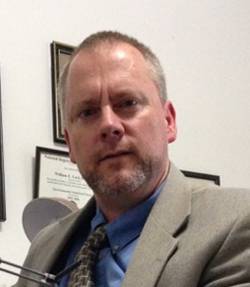 A photograph of Ed Corl, Ph.D.