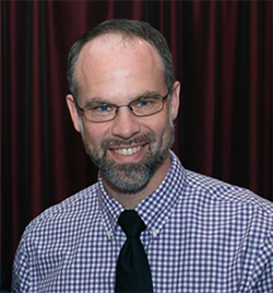 A photograph of Greg Schultz