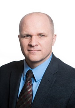 A photograph of Tim C. Johnson