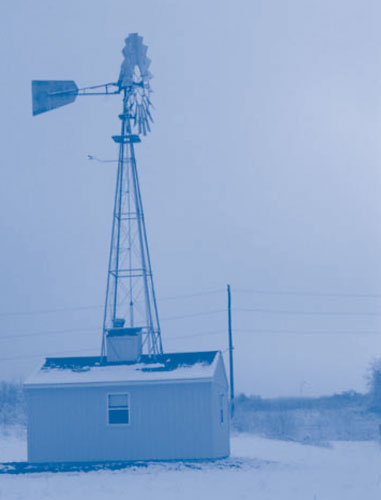 Figure 1. Ferdula landfill gas extracted by wind-generated vacuum is treated inside a 150-ft<sup>2</sup> building co-located with the windmill.
