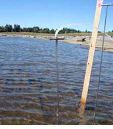 Sample collection in sub-armor of the sediment cap at the McCormick & Baxter site.