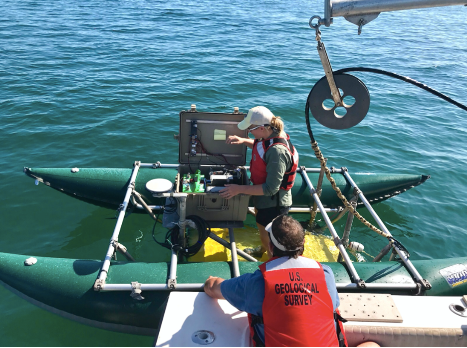 Figure 11. A USGS scientist stands on a floating sled that enables sub-bottom surveying in shallow water, nearshore, and shore-face environments. The sled is equipped with an EdgeTech SB-512i CHIRP system, and sonar equipment is used to collect sub-bottom seismic reflection data and bathymetry (USGS, 2019).