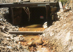 Yak Tunnel (one of two tunnels that drain the historic mining district) prior to construction of the Yak Water Treatment Plant (Source: EPA)